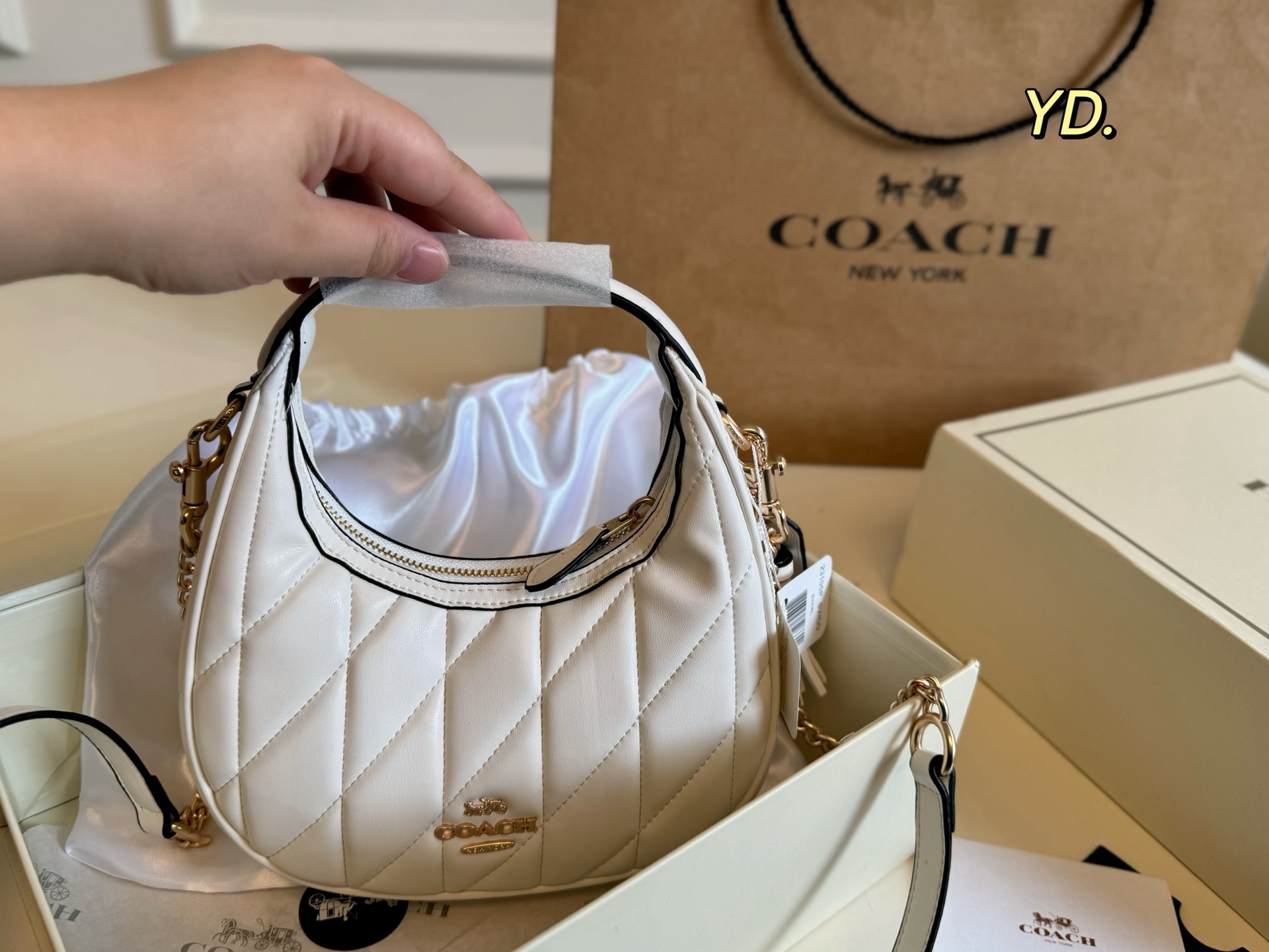 Coach's new Carmen mini crescent armpit bag - cnluxepick