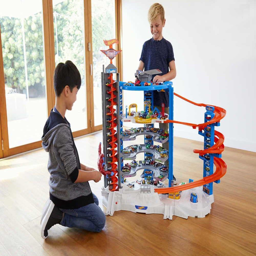 Hot Wheels Track Set with 4 1:64 Scale Toy Cars, Super Ultimate Garage, Over 3-Feet Tall