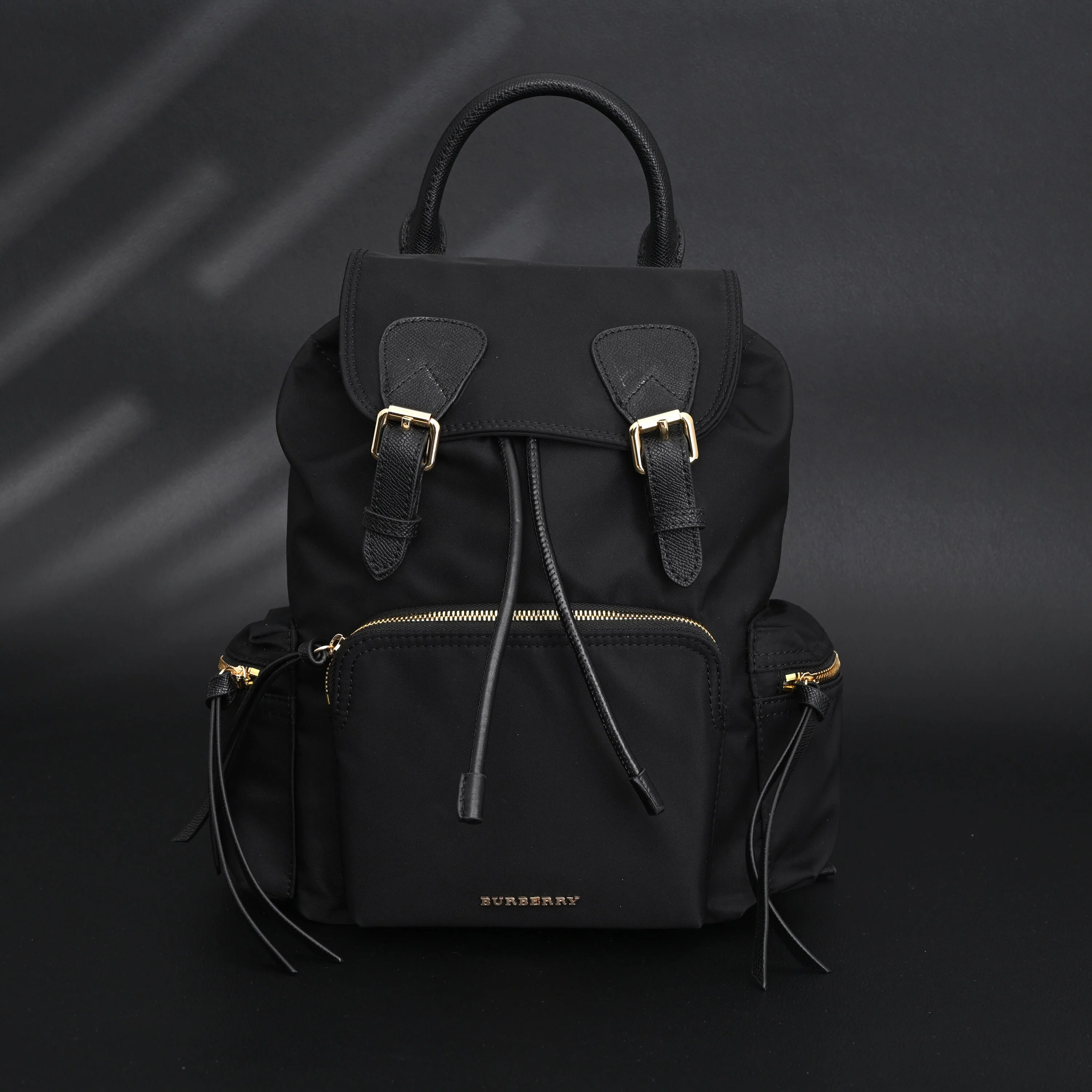 Burberry The Rucksack – Black Nylon & Leather Backpack with Gold-Tone Hardware