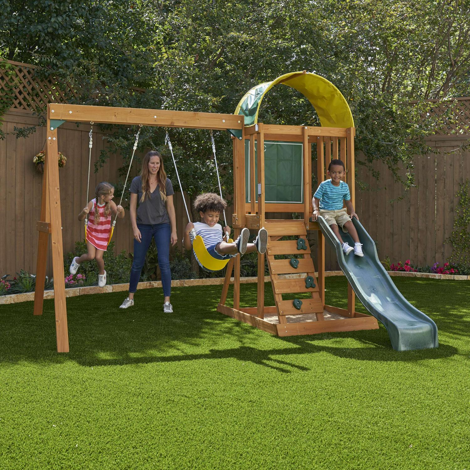 KidKraft Ainsley Wooden Outdoor Swing Set with Slide, Chalk Wall, Canopy and Rock Wall