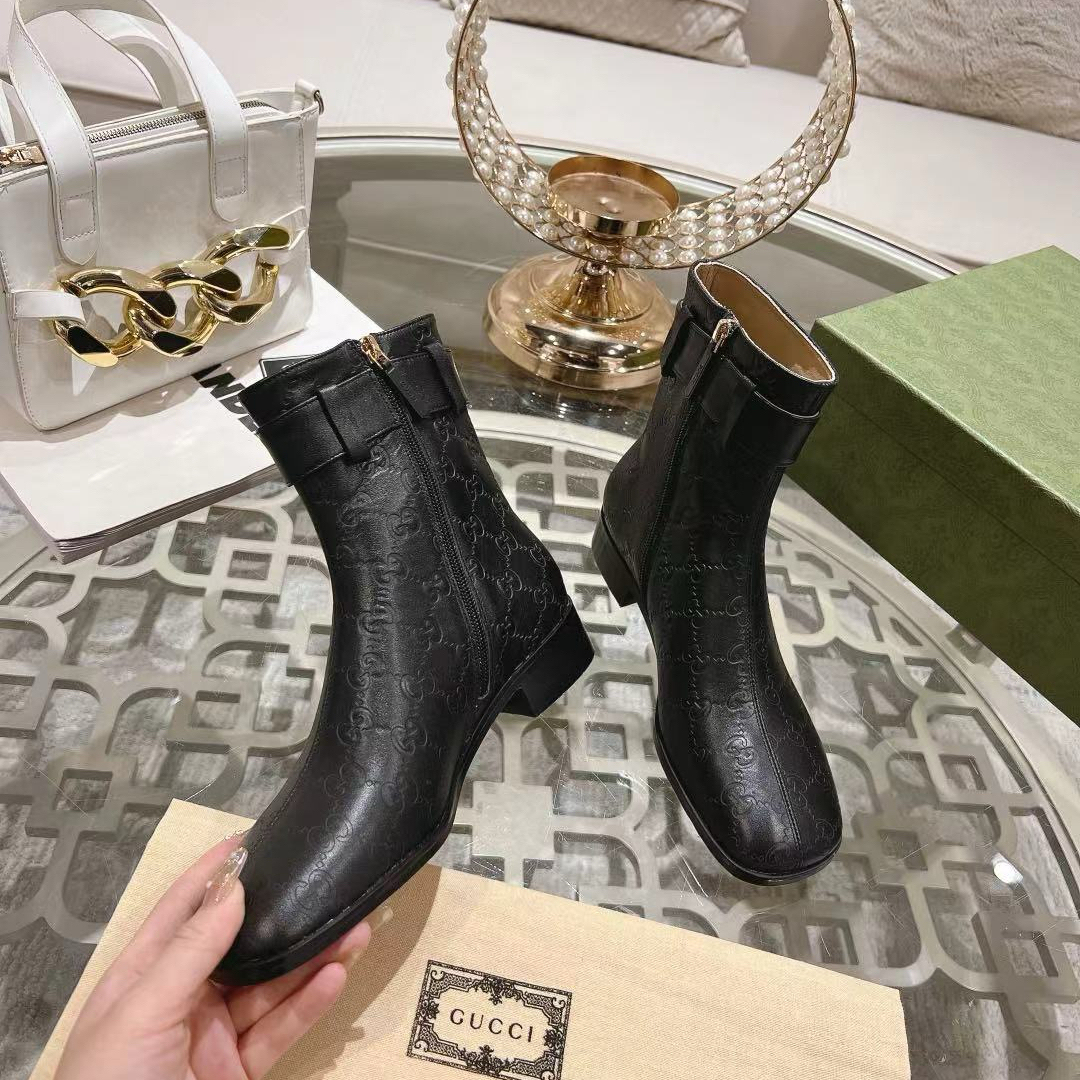 Gucci embossed boots - cnluxepick