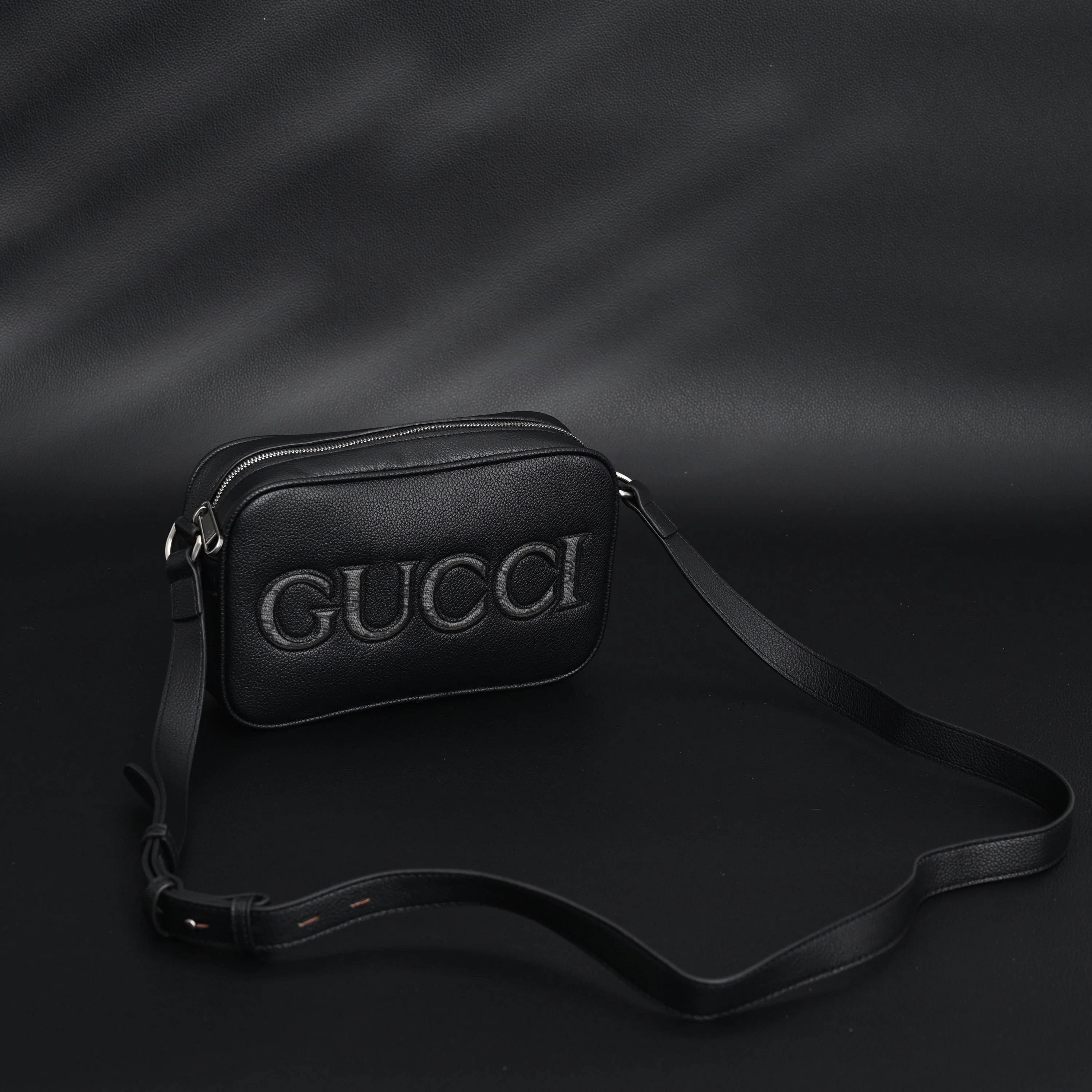Gucci Black Leather Embossed Logo Belt Bag