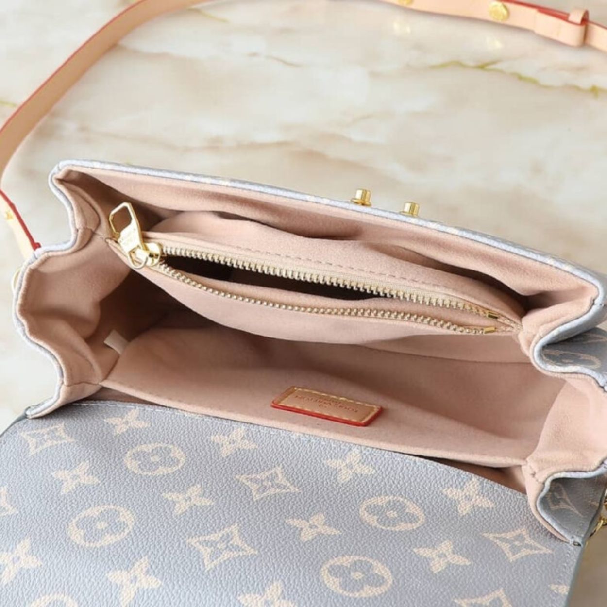 Louis Vuitton Pochette Métis East West Coated Canvas Trianon 8.5 Inches M12429