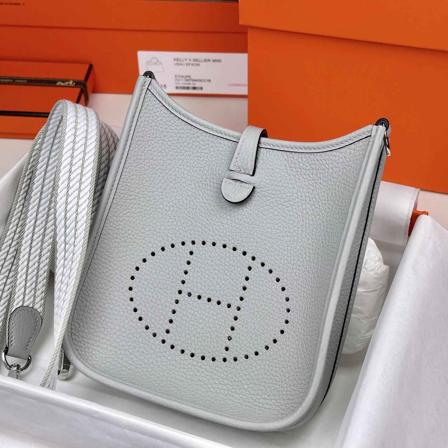 6042-Hermès Evelyne TPM Bag | Light Grey Clemence Leather with Iconic “H” Cutout