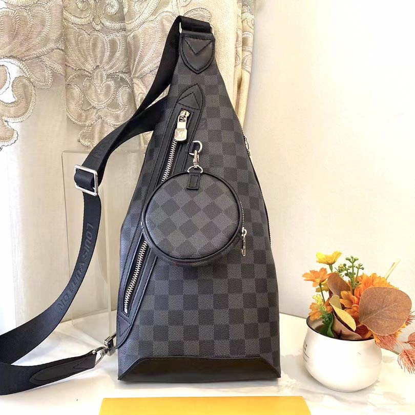 Shoulder bag paneled and has a detachable zippered pocket and zippered side pockets for coin or other needs XC S05