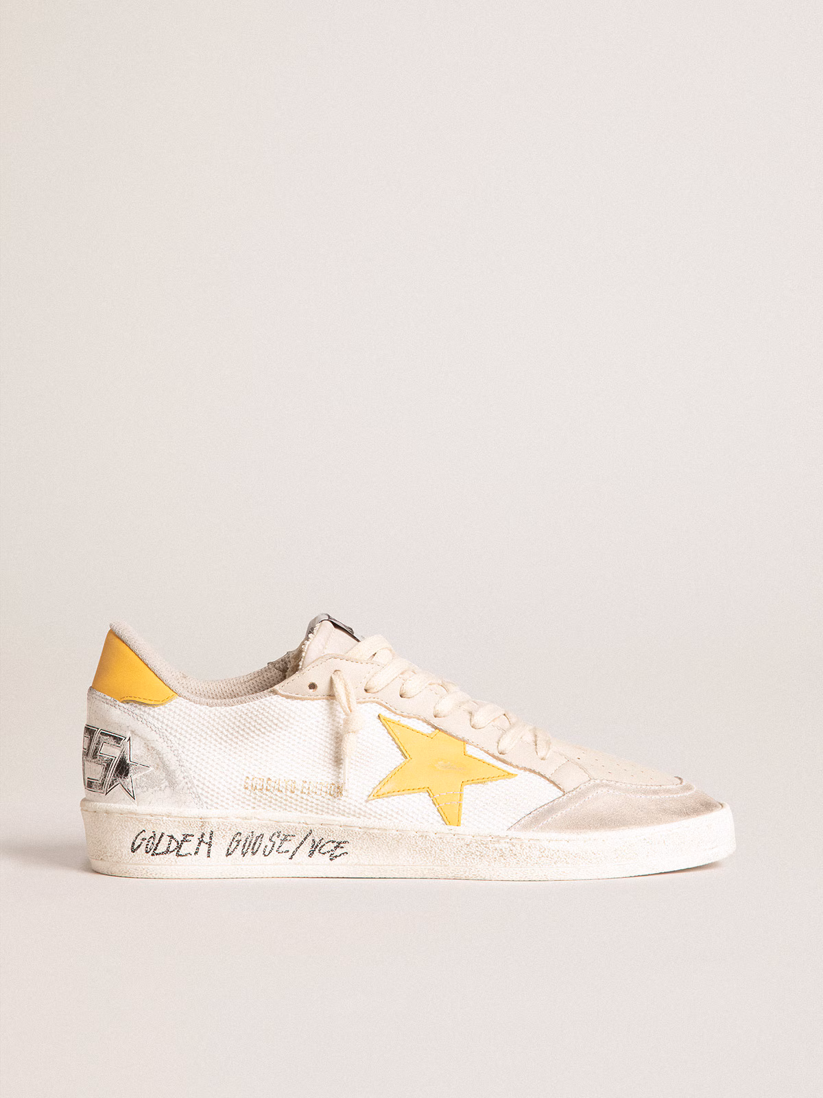Golden Goose GGDB Ball Star LTD in white mesh with yellow leather star and heel tab