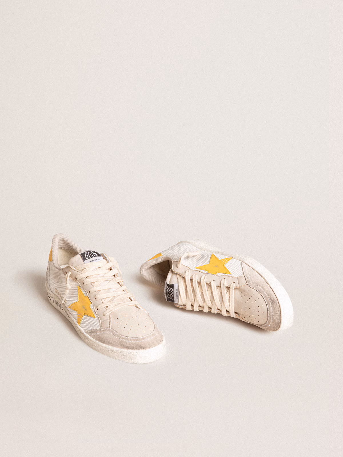 Golden Goose GGDB Ball Star LTD in white mesh with yellow leather star and heel tab