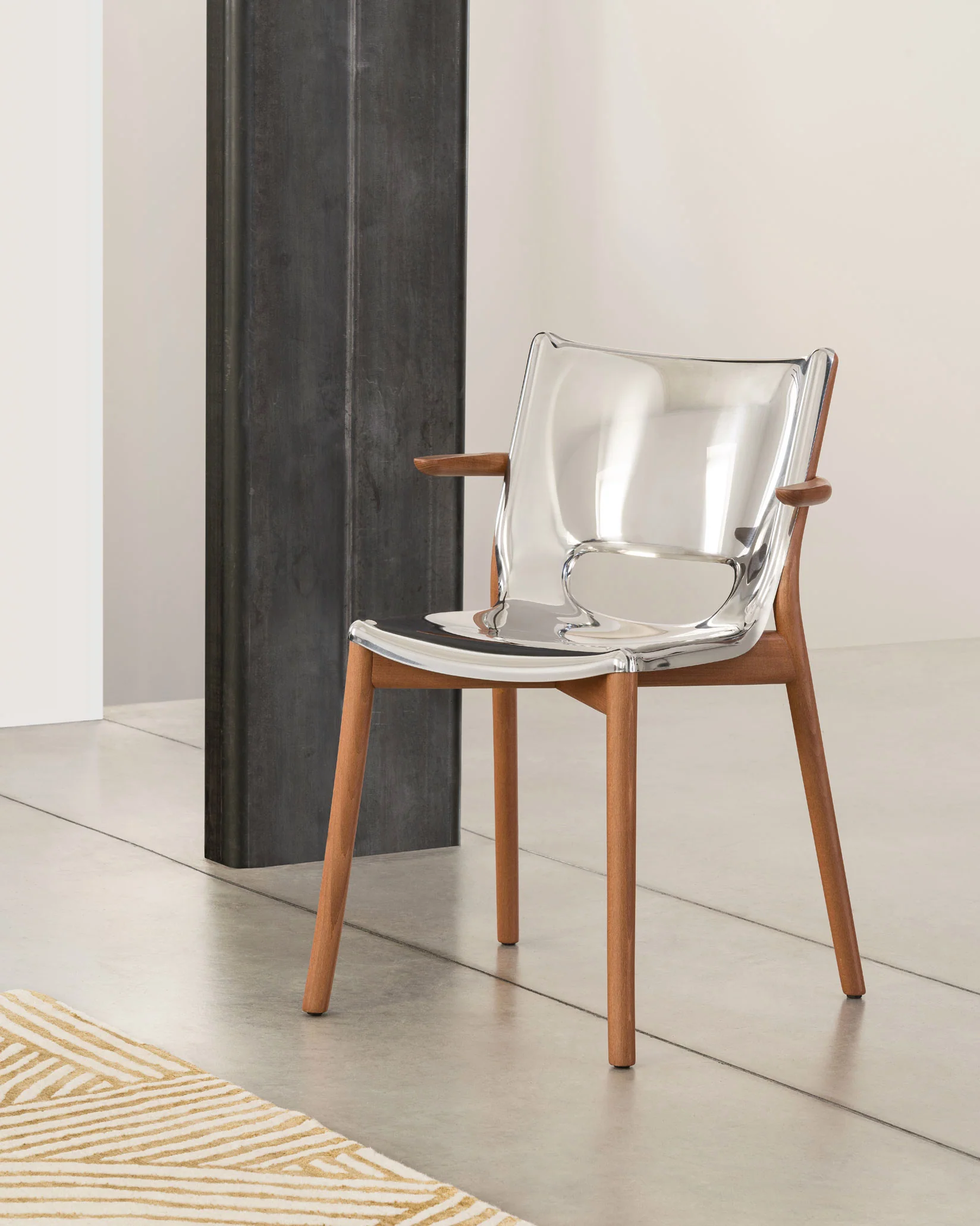Poêle Collection Monoshell chair with armrests Design Philippe Starck