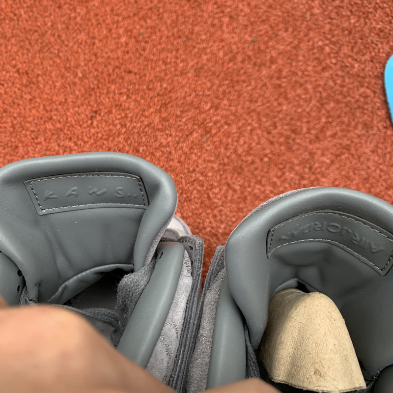 Kaws x Air Jordan 4 “Cool Grey”