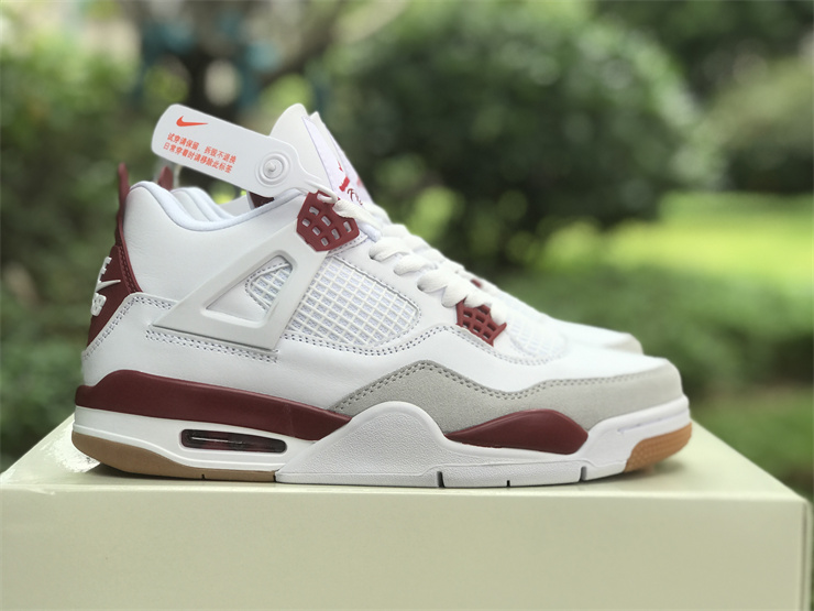 Air Jordan 4 in white and red