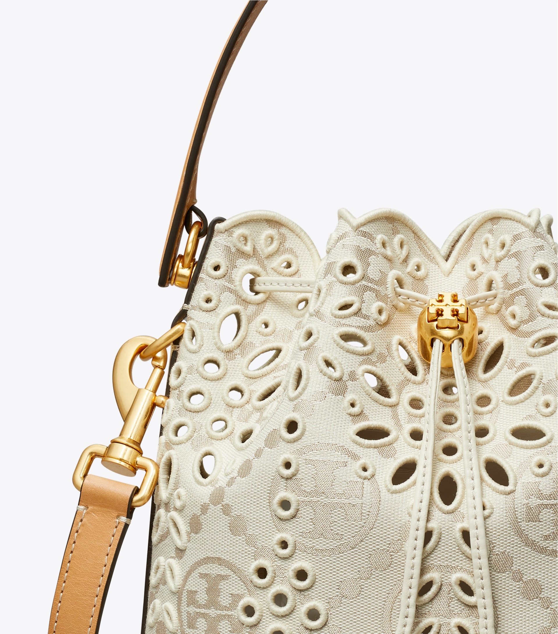 T MONOGRAM EYELET BUCKET BAG