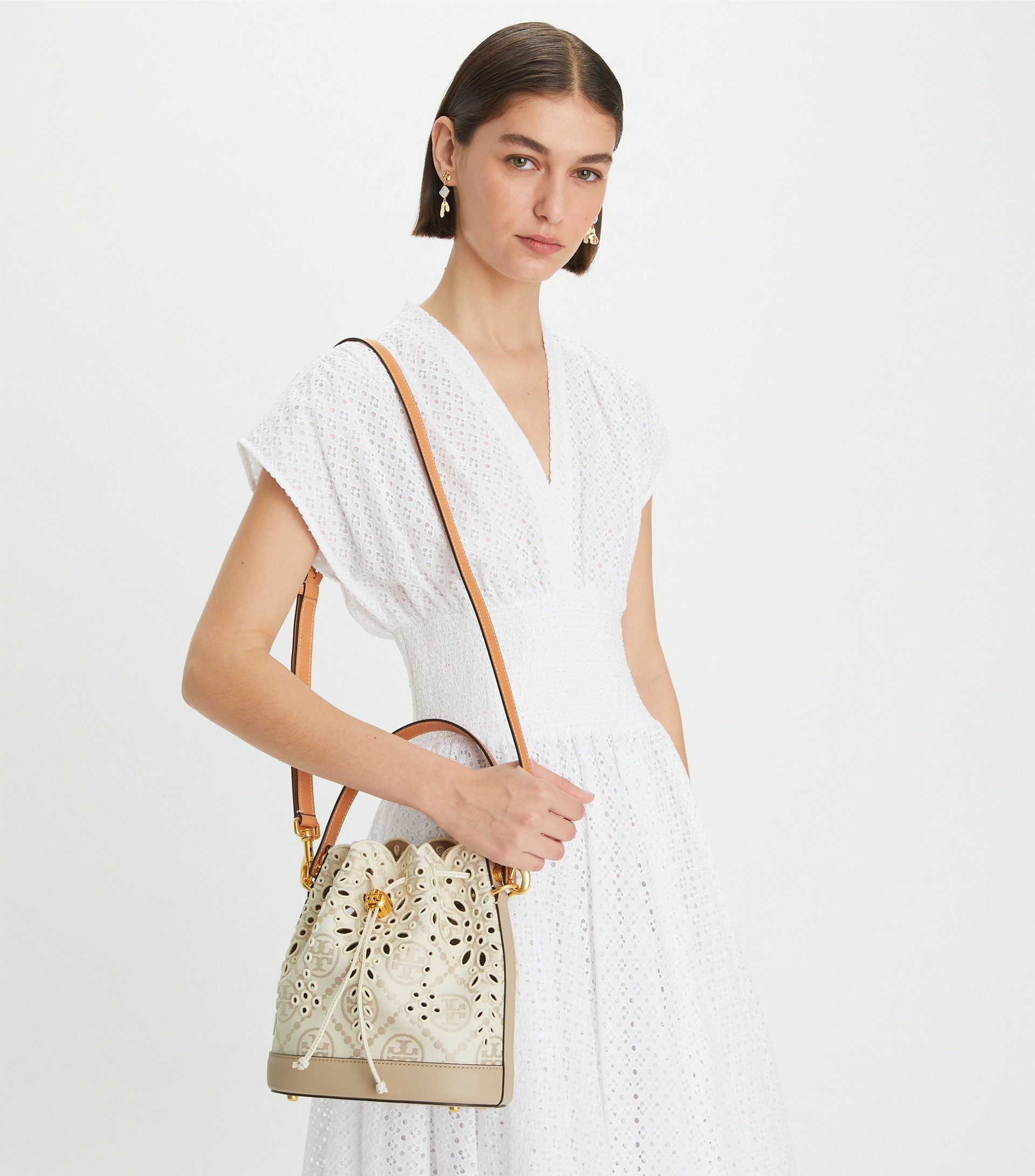 T MONOGRAM EYELET BUCKET BAG