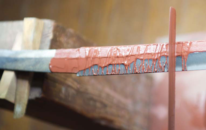 Learn about the art and science of clay tempering in swordsmithing, a technique that enhances blade performance and creates unique hamon patterns. Clay application. differential hardening.